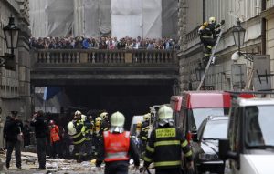 Firefighters search the area after an explosion in Prague