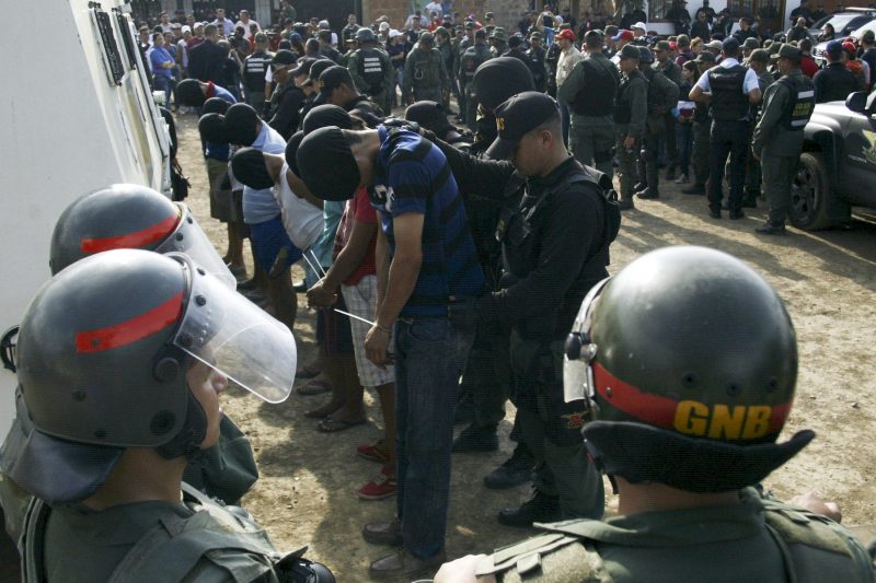 Venezuelan soldiers detain and escort men whom local media reported were suspected to be linked to a paramilitary group from Colombia, during a special deployment, at San Antonio in Tachira state, Venezuela