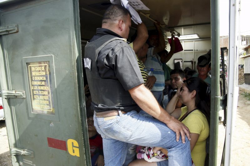 People who do not possess proper documentation to travel into Venezuela are detained in a truck by venezuelan border officials during a special deployment, at San Antonio in Tachira state