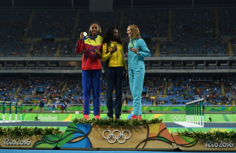 (LtoR) Venezuela's Yulimar Rojas (silver medal), Colombia's Caterine Ibarguen (gold medal) and Kazakhstan's Olga Rypakova (bronze medal) pose during the podium ceremony for the women's Triple Jump during the athletics event at the Rio 2016 Olympic Games at the Olympic Stadium in Rio de Janeiro on August 15, 2016.   / AFP PHOTO / Johannes EISELE