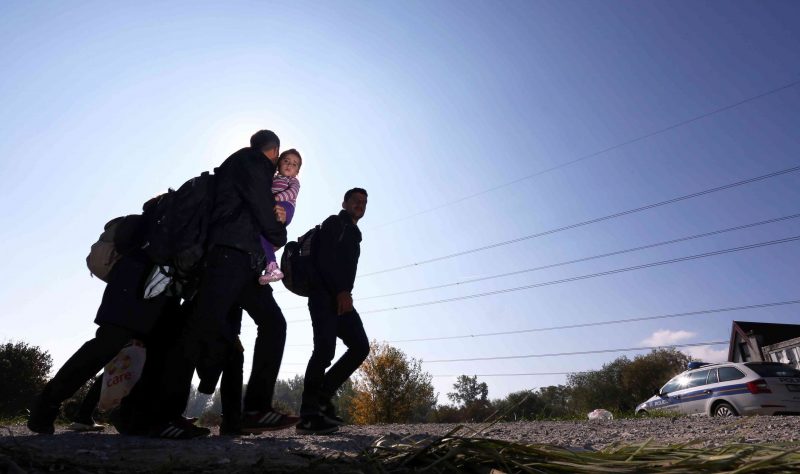 Around 2000 migrants who arrived by train, walk near the border town of Kljuc Brdovecki, on October 24, 2015, to cross the Croatia-Slovenia border. Crowds of refugees and other migrants camp by roads in western Balkan countries in worsening autumn weather after Hungary sealed its borders with Serbia and Croatia, causing a chain reaction in other overwhelmed states. Bulgaria, Romania and Serbia on October 24 threatened to close their borders if EU countries stopped accepting migrants, as European leaders prepared for a mini summit on the continent's worst refugee crisis since World War II. AFP PHOTO / STRINGER