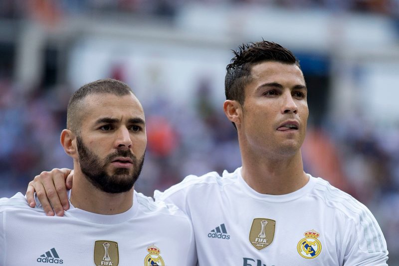 MADRID, SPAIN - SEPTEMBER 26: Karim Benzema (L) of Real Madrid CF and his teammate Cristiano Ronaldo (R) pose together at the line up prior to start the La Liga match between Real Madrid CF and Malaga CF at Estadio Santiago Bernabeu on September 26, 2015 in Madrid, Spain. (Photo by Gonzalo Arroyo Moreno/Getty Images)