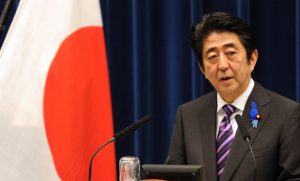 Japanese Prime Minister Shinzo Abe speaks during a press conference at his official residence in Tokyo on July 1, 2014. Japan on July 1 loosened the binds on its powerful military, proclaiming the right to go into battle in defence of allies, in a highly controversial shift in the nation's pacifist stance. AFP PHOTO / KAZUHIRO NOGI JAPAN-DEFENCE-SECURITY-POLITICS