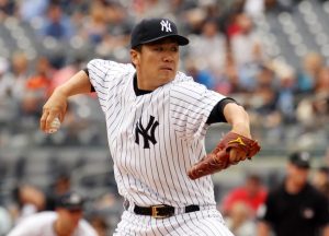 Jun 5, 2014; Bronx, NY, USA; New York Yankees starting pitcher Masahiro Tanaka (19) delivers a pitch against the Oakland Athletics in the first inning at Yankee Stadium. Mandatory Credit: Noah K. Murray-USA TODAY Sports